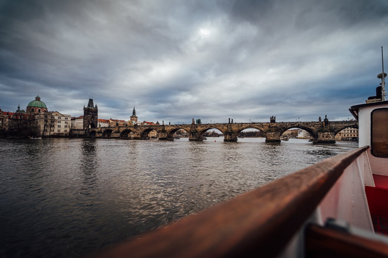 View of the historic Charles Bridge spanning the Vltava River in Prague, Czech Republic.